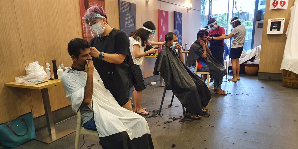 Roxy Foundation volunteers providing free haircut services to community members