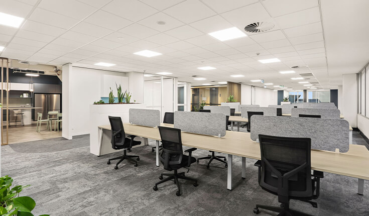 Open-plan office workstations at 33 Argyle Street, Sydney with shared desks