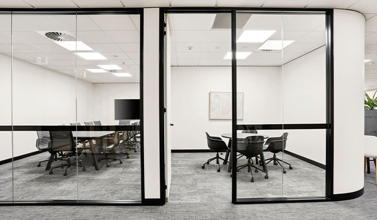 Enclosed meeting spaces at 33 Argyle Street in Sydney with modern office setup