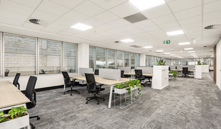 Open office workspace at 33 Argyle Street in Australia with desks and partitioned seating