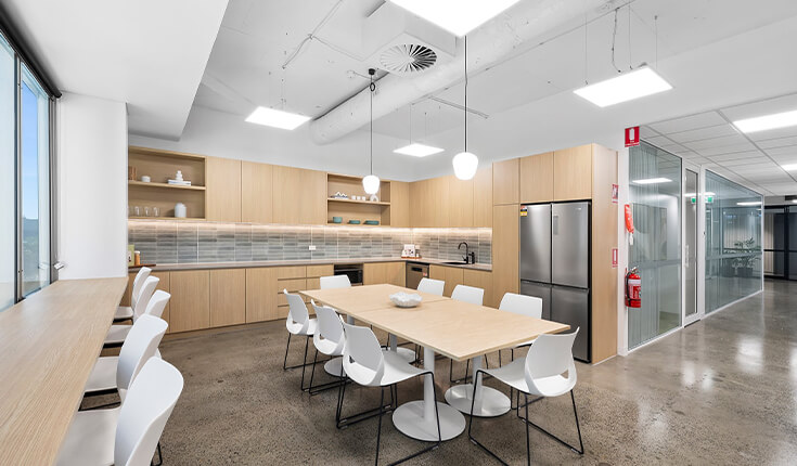 Office pantry and dining area at 33 Argyle Street, Sydney with table and kitchen