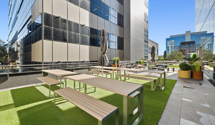Outdoor terrace at 33 Argyle Street, Sydney with seating and greenery