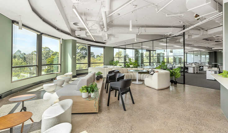 Open office lounge at 312 St Kilda Road with collaborative seating and large windows