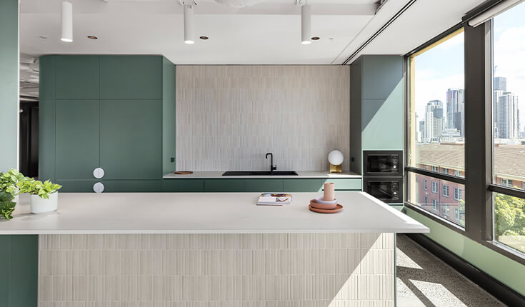 Modern office kitchen at 312 St Kilda Road with island counter and window view
