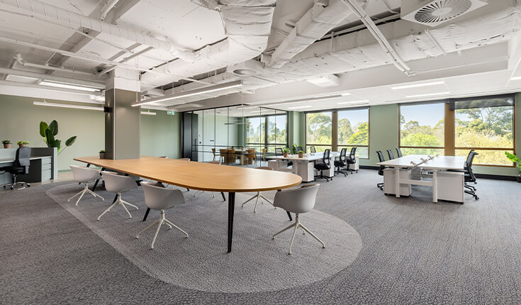 Open-plan office workspace at 312 St Kilda Road with desks and meeting table