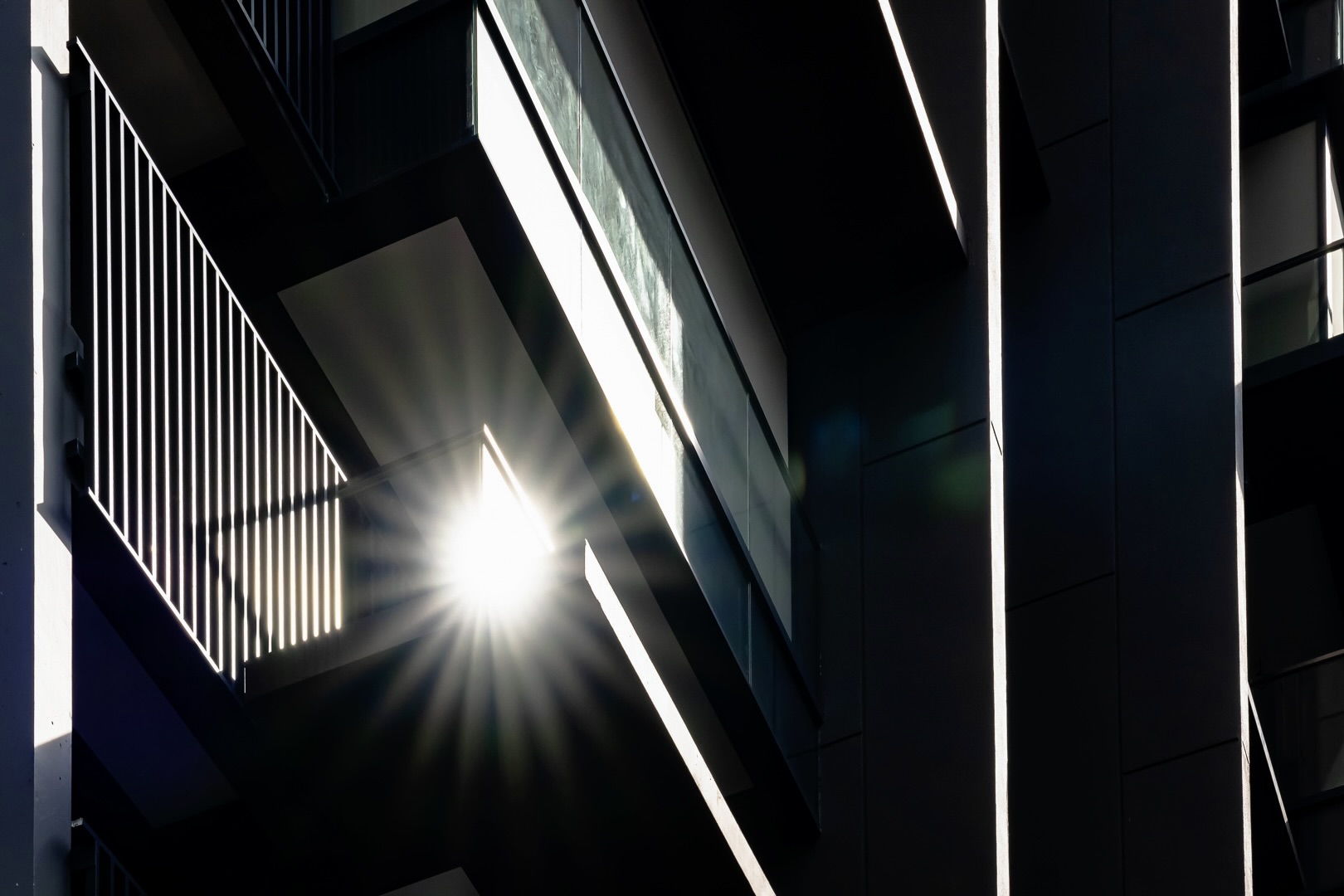 Modern residential architectural lighting and glass facade by Roxy-Pacific