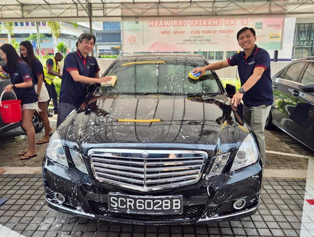 Roxy Foundation volunteers washing cars during charity fundraising event