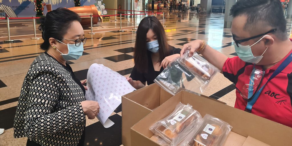 Community outreach distributing care packages to essential workers